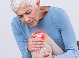 Woman suffering with osteoarthritis