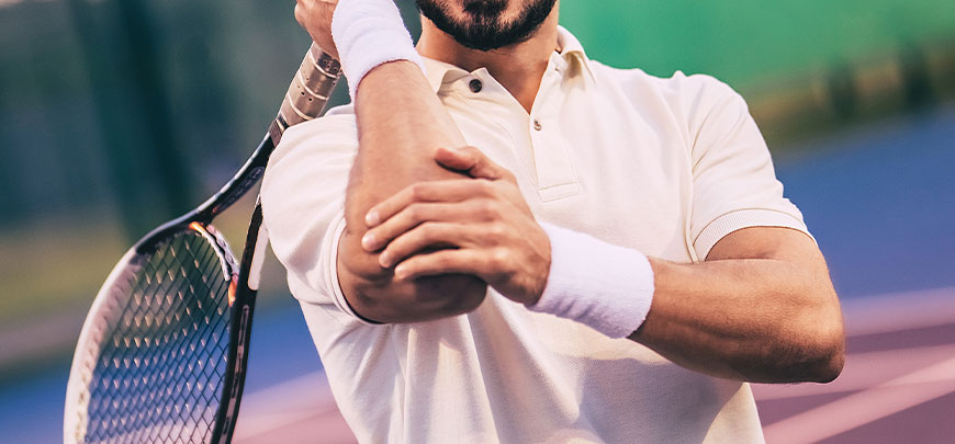 Patient experiencing tennis elbow and in need of a chiropractor